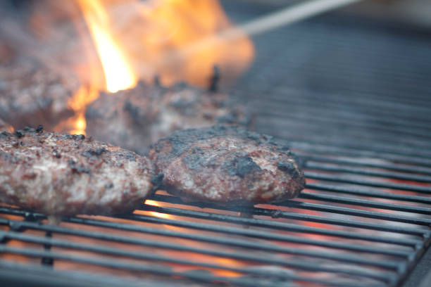 istock Beefburgers Cooking On An Open Barbecue 691334220