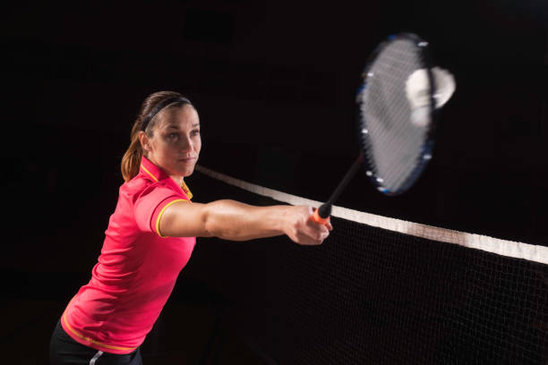 istock Female badminton player hitting the shuttlecock 691335004