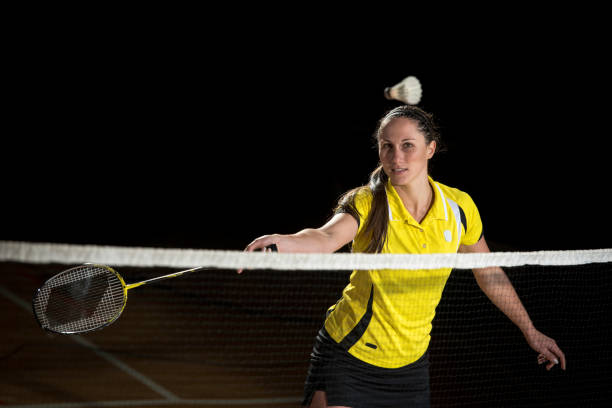 istock Female badminton player about to hit the shuttlecock 691337356