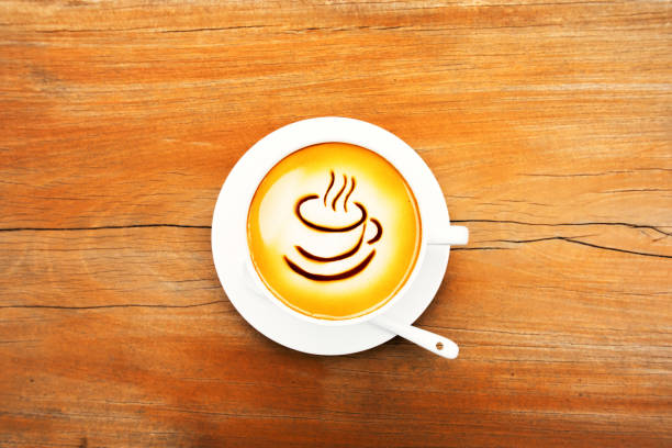 istock Cup of coffee on the wooden table 691338940