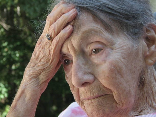 istock Elderly woman with headache 691346874