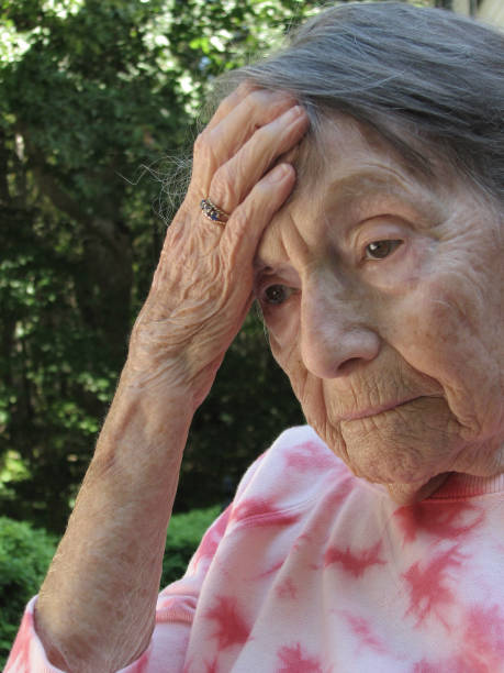 istock Elderly woman with a headache 691346886