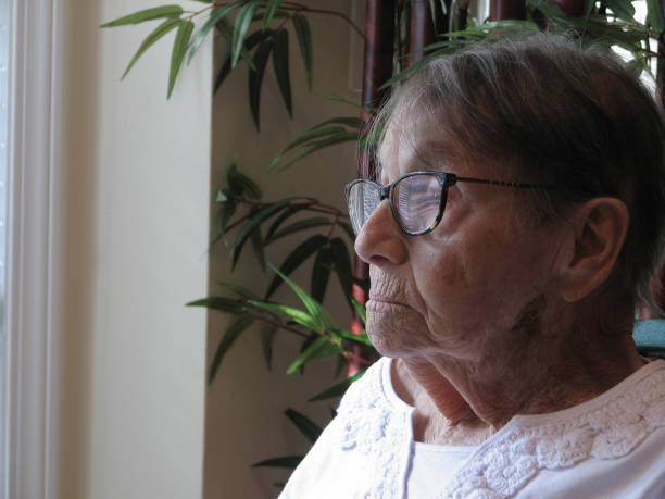 istock Elderly woman gazing outside 691346902