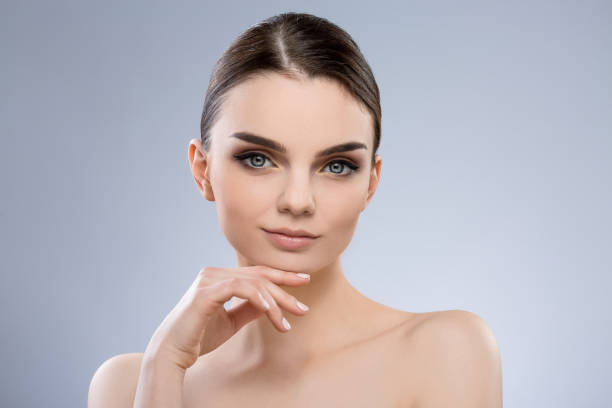 istock Beautiful girl with nude make up at studio 691354058