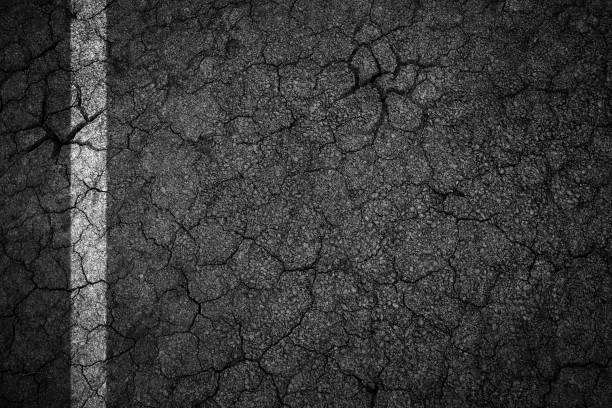 istock Old crack asphalt road with white lines 691360896