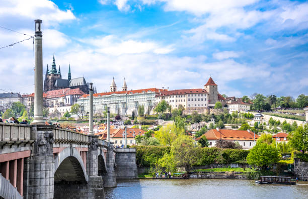 istock Ancient Gothic Prague in the spring. Bridge across the Vltava River 691369740