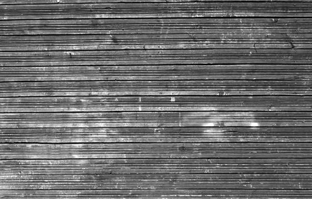 istock Grungy weathered gray color wood wall. 691369926