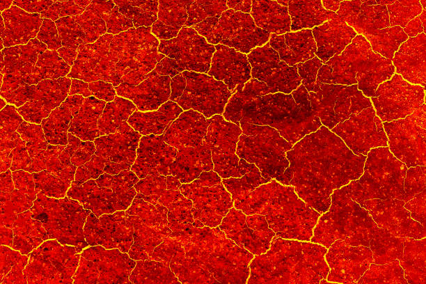 istock heat red cracked ground texture after eruption volcano 691370944
