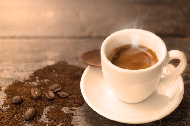 istock Espresso coffee with coffee beans and grounds 691373378
