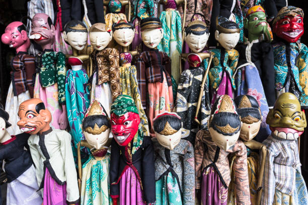 Traditional Javanese wooden puppets in Jakarta flea market Traditional Javanese wooden puppets called Wayang display in the Jalan Surabaya flea market in Jakarta, Indonesia capital city. wayang kulit photos stock pictures, royalty-free photos & images