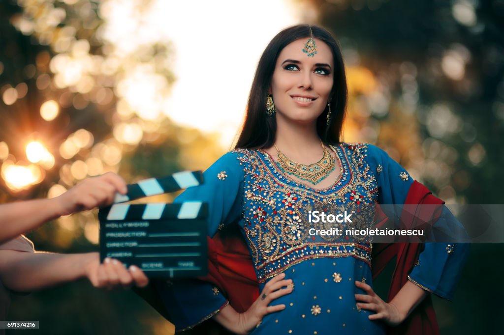 Bollywood Actress Wearing An Indian Outfit With Gold Jewelry Set Stock  Photo - Download Image Now - iStock