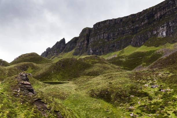 istock Pretty green valley in the Quiraing with small pond 691377700