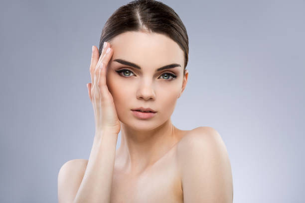 istock Beautiful girl with nude make up at studio 691380792
