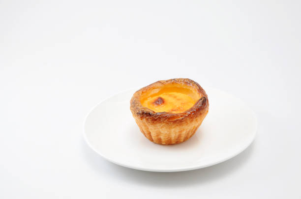 istock egg tart cheese pie on a plate on white background 691383876