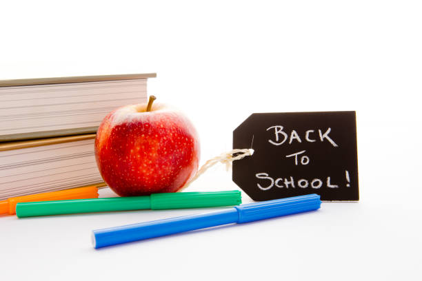 istock Back to School - Red Apple, books and pens 691384504