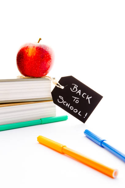 istock Back to School - Red Apple, books and pens 691384550