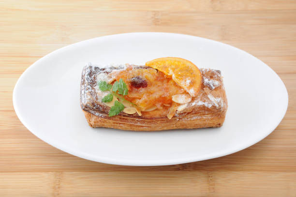istock orange marmalade tart pie on a plate on cutting board 691385058