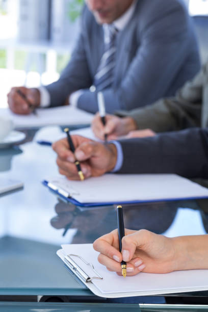 istock Business team redacting contracts 691385476