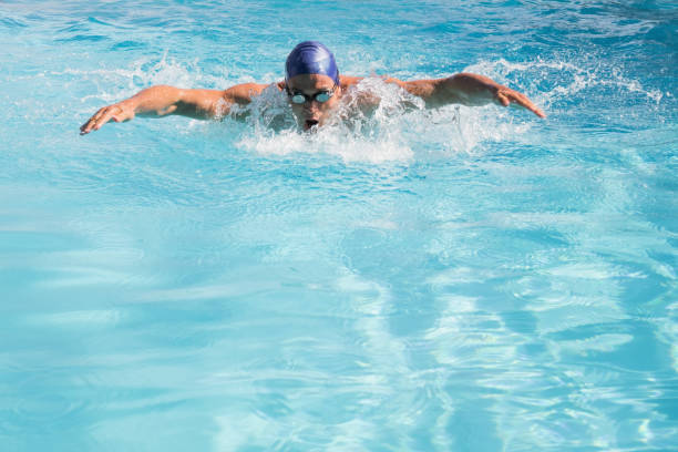 istock Fit swimmer doing the butterfly stroke in the swimming pool 691387708