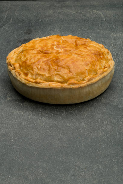 istock Whole Meat Pie on Stone Countertop with Copy Space 691387774