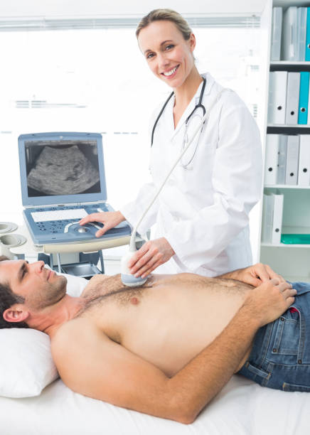 istock Doctor using sonogram on male patient 691388348