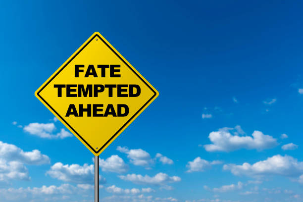 istock FATE TEMPTED AHEAD - Road Warning Sign 691403854