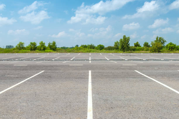 istock Empty parking lot against a beautiful blue sky 691406280