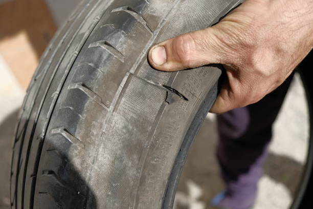istock Explosive car tire and rubber tire repairer hands 691414782