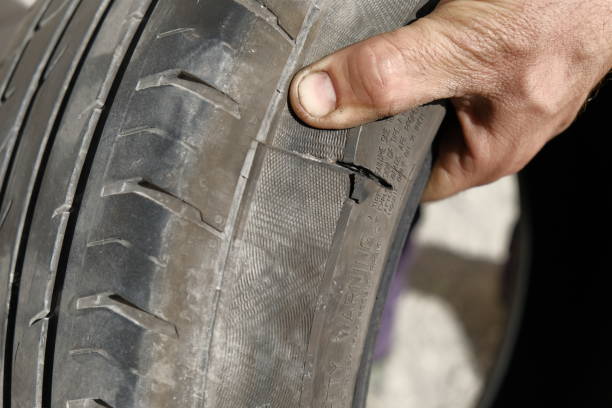 istock Explosive car tire and rubber tire repairer hands 691414794