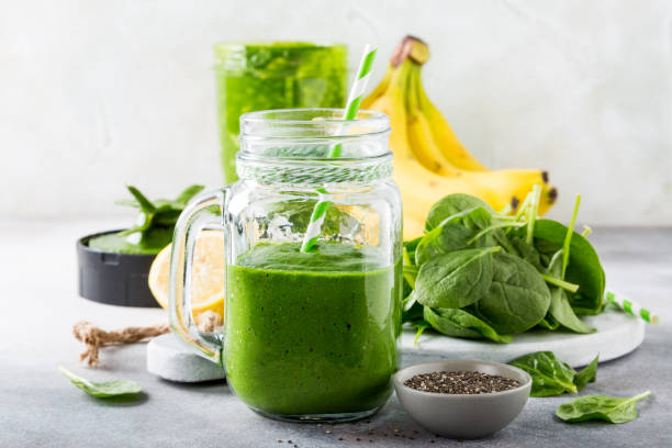 istock Healthy green smoothie with spinach in glass jar 691414902