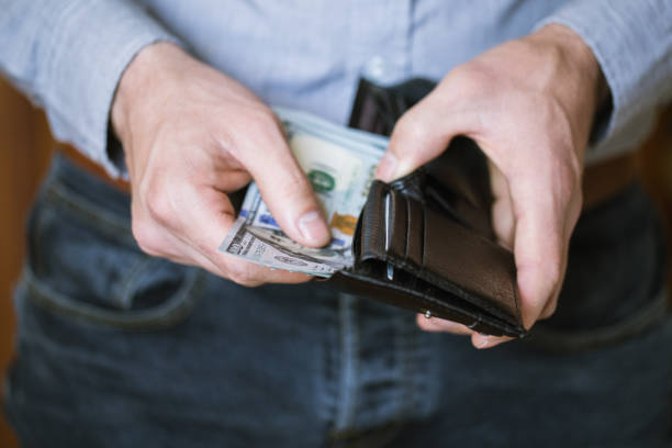 istock Businessman holding money in his hands 691415298