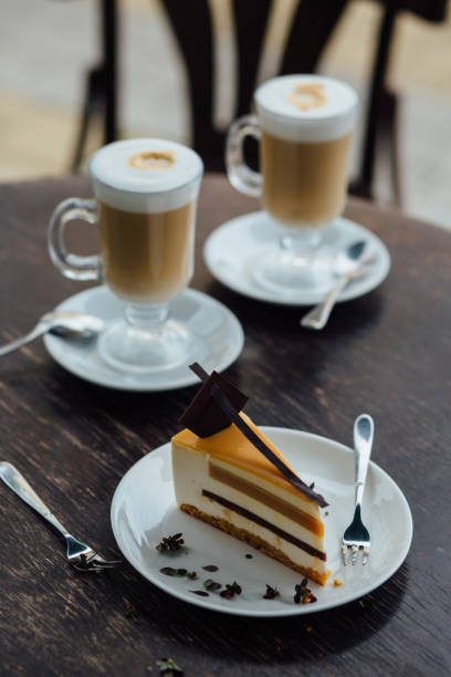 istock Two cups of coffee with cake 691417420