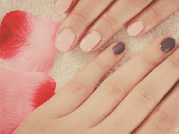 istock Woman presenting her beautiful painted gel hybrid nails 691417558