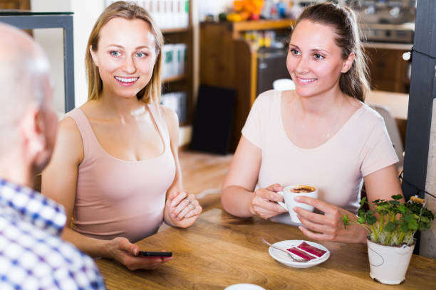 istock young and joyous people spending time in cafe 691418610