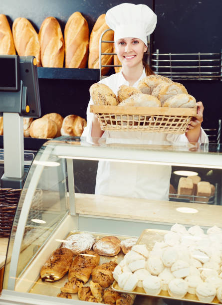istock Woman offering bread in bakery 691418654