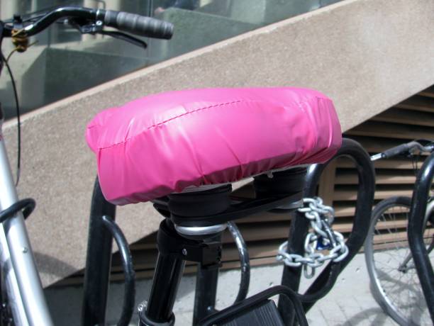 Pink protective bike seat cover Pink protective bike seat cover plastination photos stock pictures, royalty-free photos & images