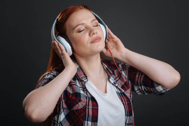 istock Beautiful inspired woman enjoying her hobby 691418912