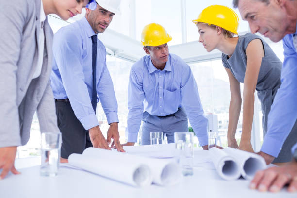 istock Team of business people speaking about construction plan 691419088