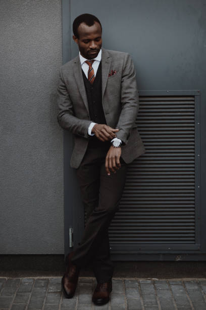 istock confident stylish african american businessman posing outdoors at wall 691420124