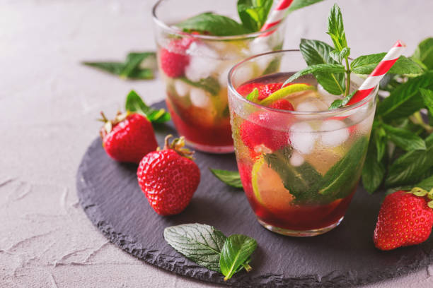 istock Cold lemonade with fresh strawberry, mint, lime and jam 691422864