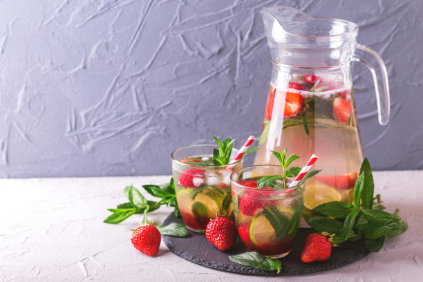 istock Cold lemonade with fresh strawberry, mint, lime and jam 691423338