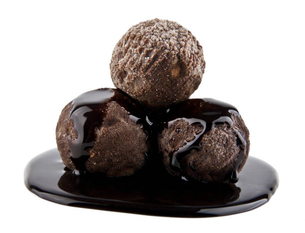 istock Chocolate truffles isolated on white background 691423390