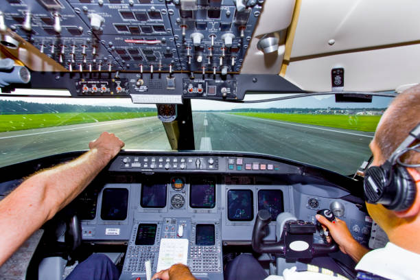 istock Young co-pilot at work in a cabin of commercial jet 691427162