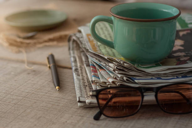 istock Newspapers on wooden floor. 691429470