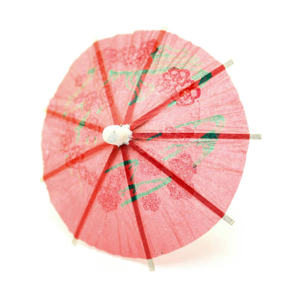 istock Cocktail umbrella close-up isolated on white background 691429970