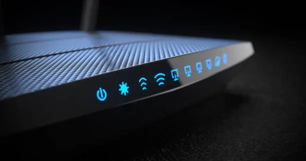 Photo of Wi-Fi wireless internet router on dark background