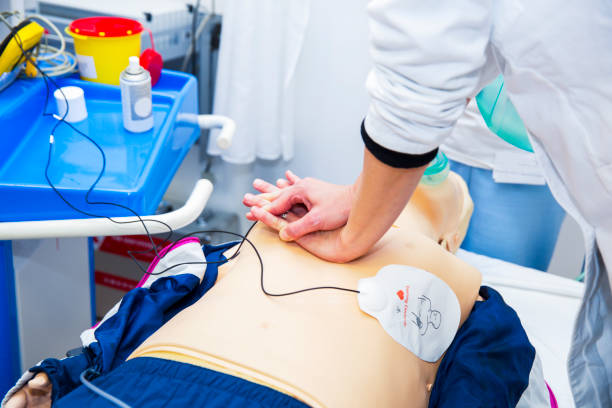 istock CPR seminar.....heart massage of CPR dummy 691433342