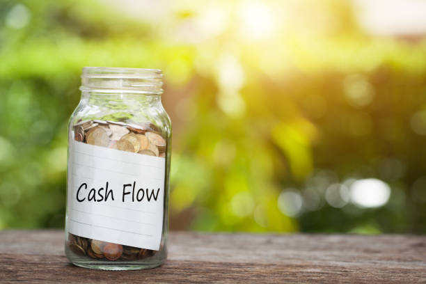 istock coin in jar with cash flow text, Financial Concept. 691433562