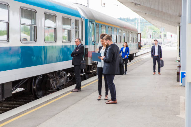 istock Business people on a railroad station waiting for train 691437304