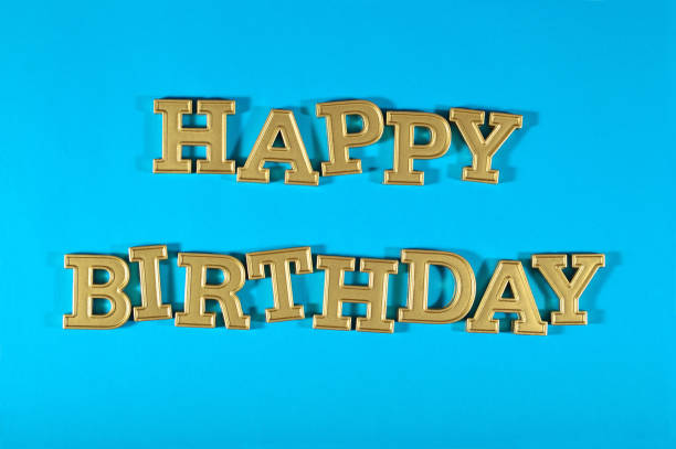 istock Happy birthday golden text on a blue 691437376
